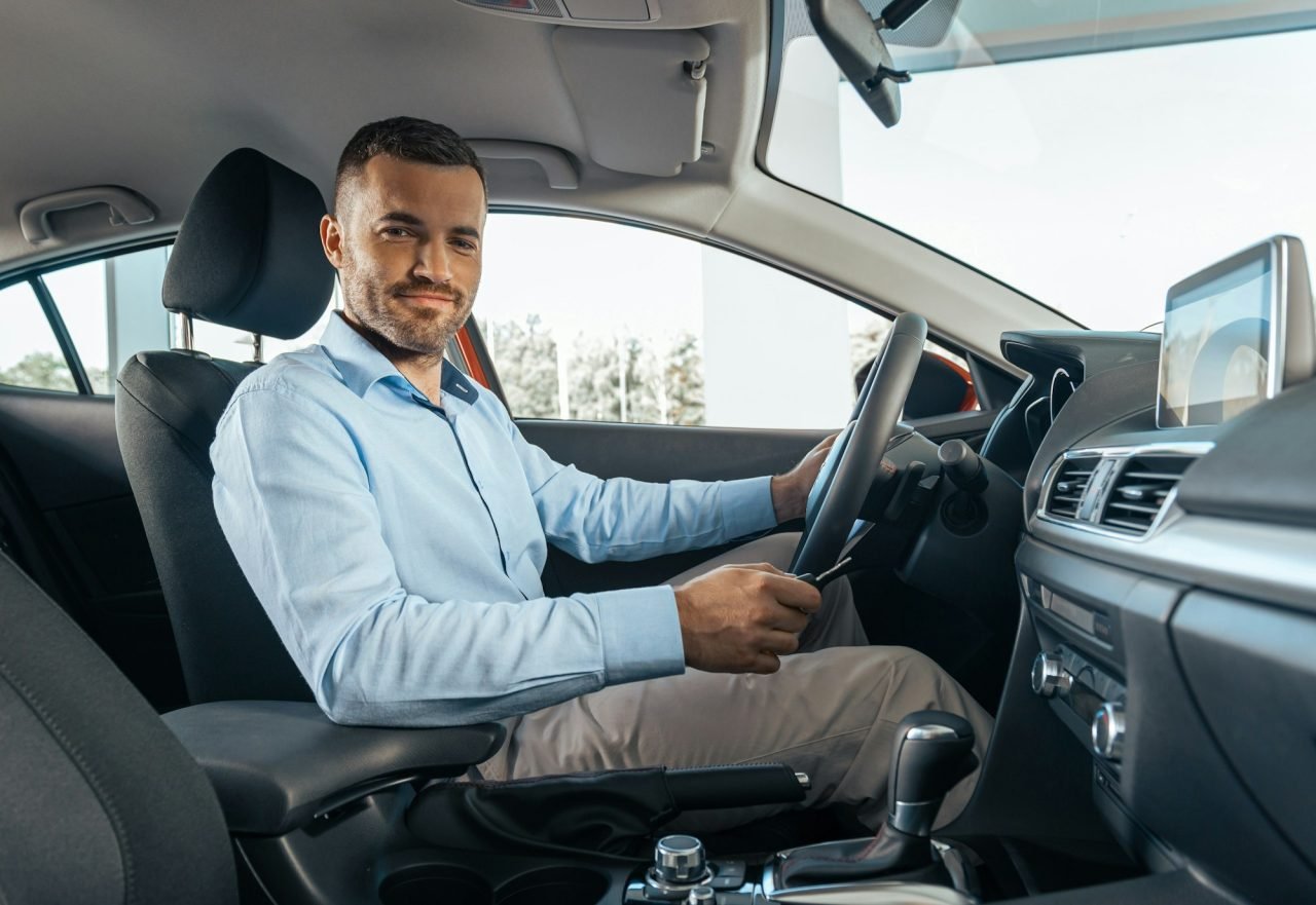 young-businessman-in-a-car-rental-service-test-drive-concept.jpg